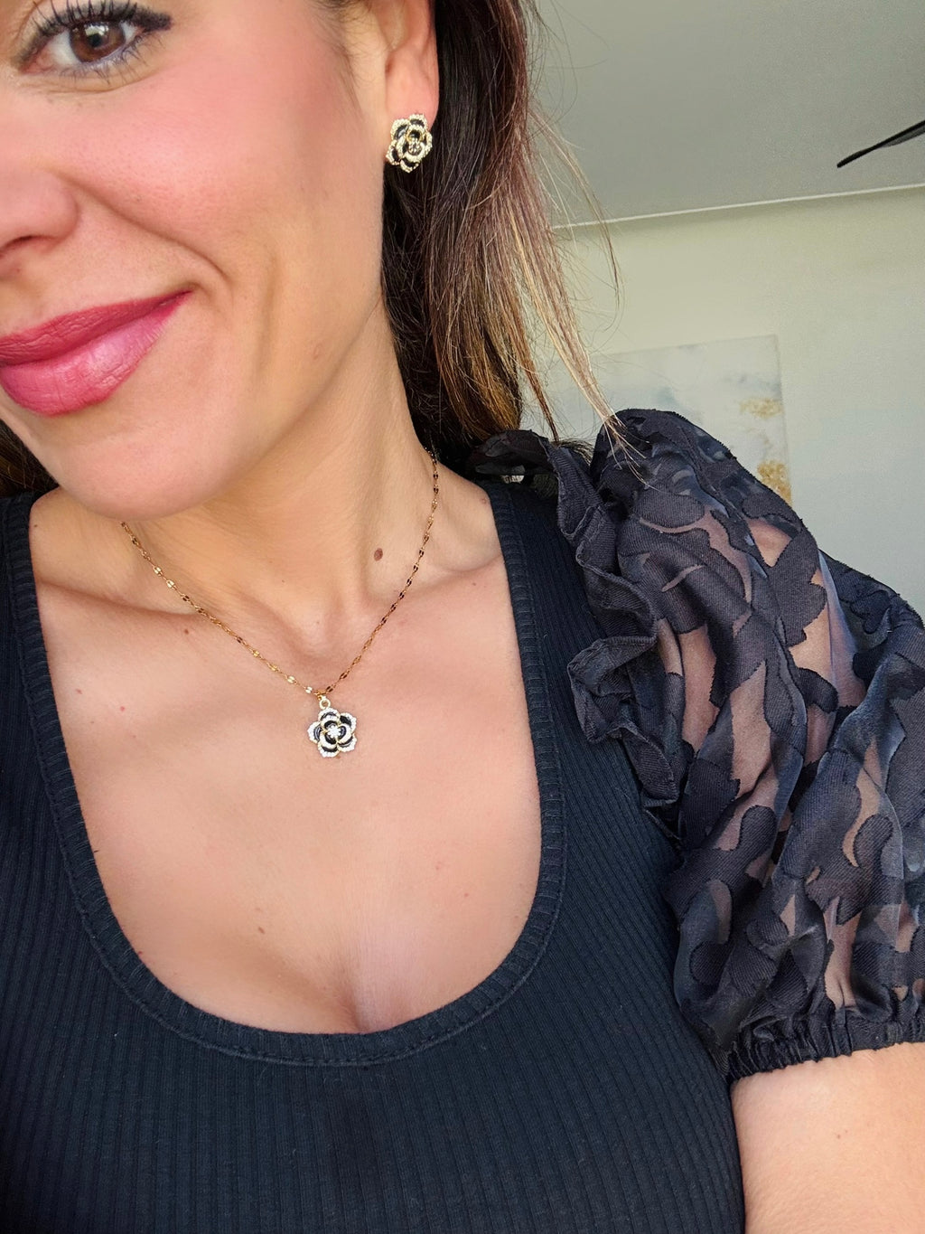 Black Camellia necklace in gold on mama card
