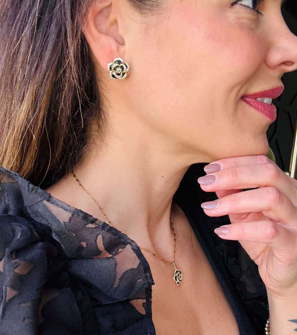 Black Camellia earrings in gold on mama card